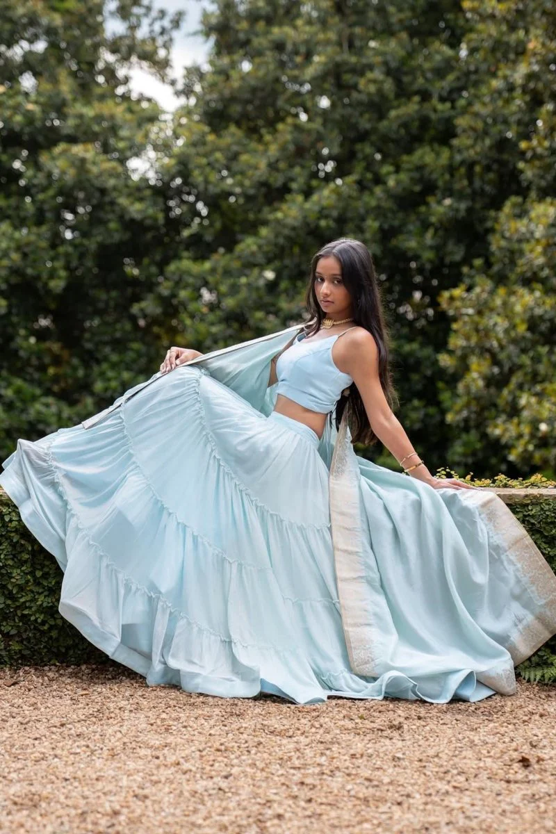 Sky Blue Shimmer Tiered Lehenga Choli with Gold Accents for Women