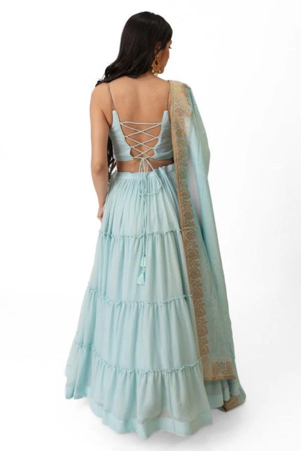 Sky Blue Shimmer Tiered Lehenga Choli with Gold Accents for Women - Image 2